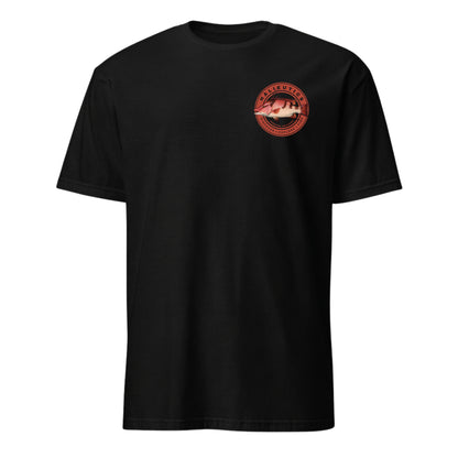A black short-sleeve crewneck t-shirt with a circular red and pink graphic hog fish printed on the left chest, displayed on a solid white background.